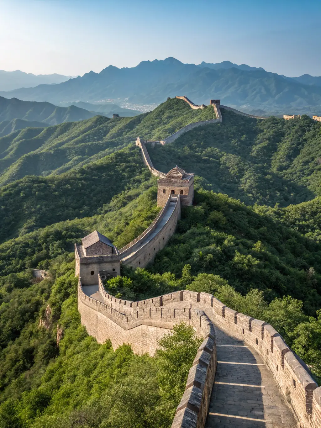 A breathtaking view of the Great Wall of China winding through the mountains, emphasizing the grandeur and historical importance of the landmark for SkyGuidance's travel destinations.